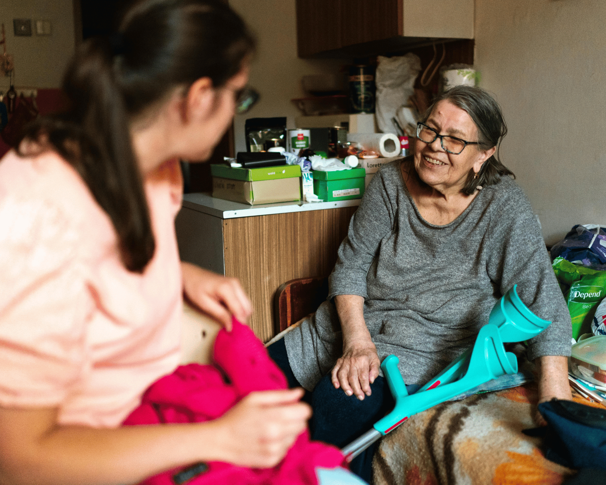 Caregiver playing a memory-building board game with a senior