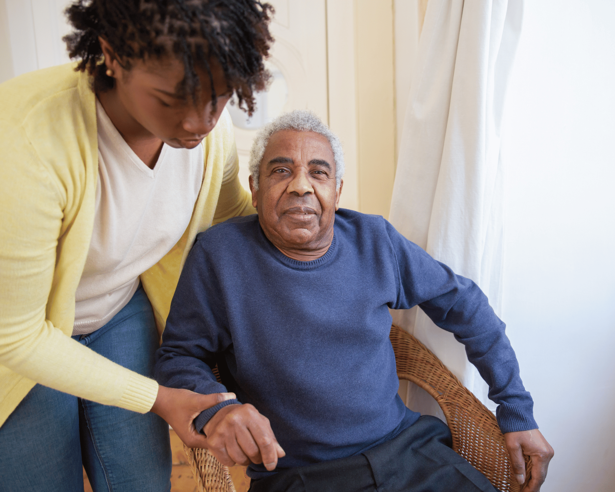 Caregiver helping a senior walk safely with a walker during recovery